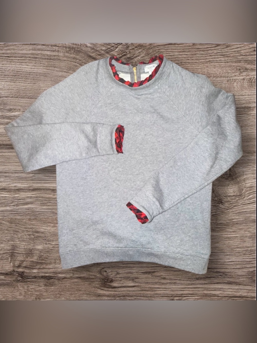 J.Crew grey cotton sweatshirt features a festive red and black buffalo plaid ruf
